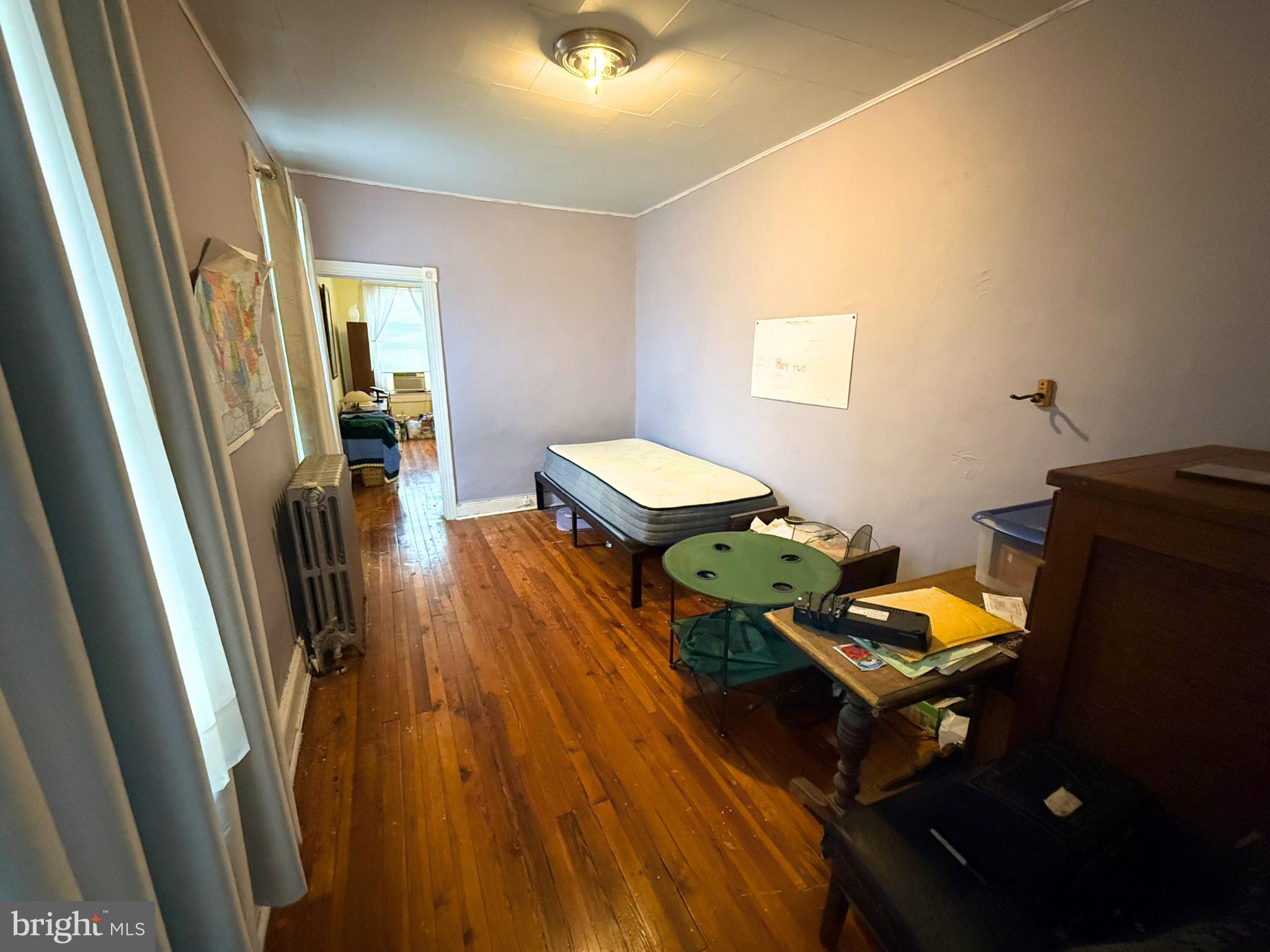 2680 St Benedict Street Baltimore, MD 21223 - Photo 19 of 27 a living room with furniture and wooden floor