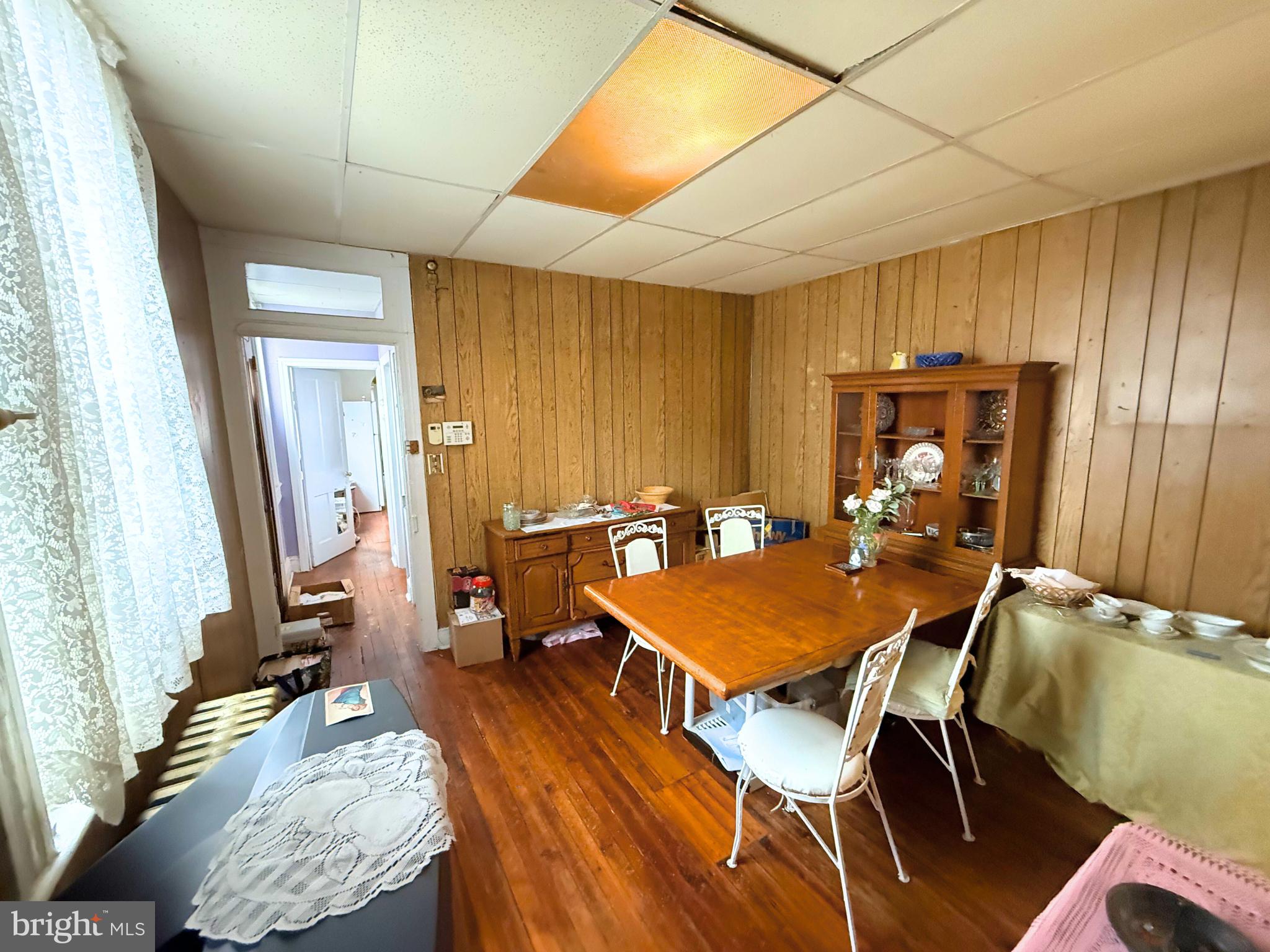 2680 St Benedict Street Baltimore, MD 21223 - Photo 8 of 27 a dining room with a table and chairs
