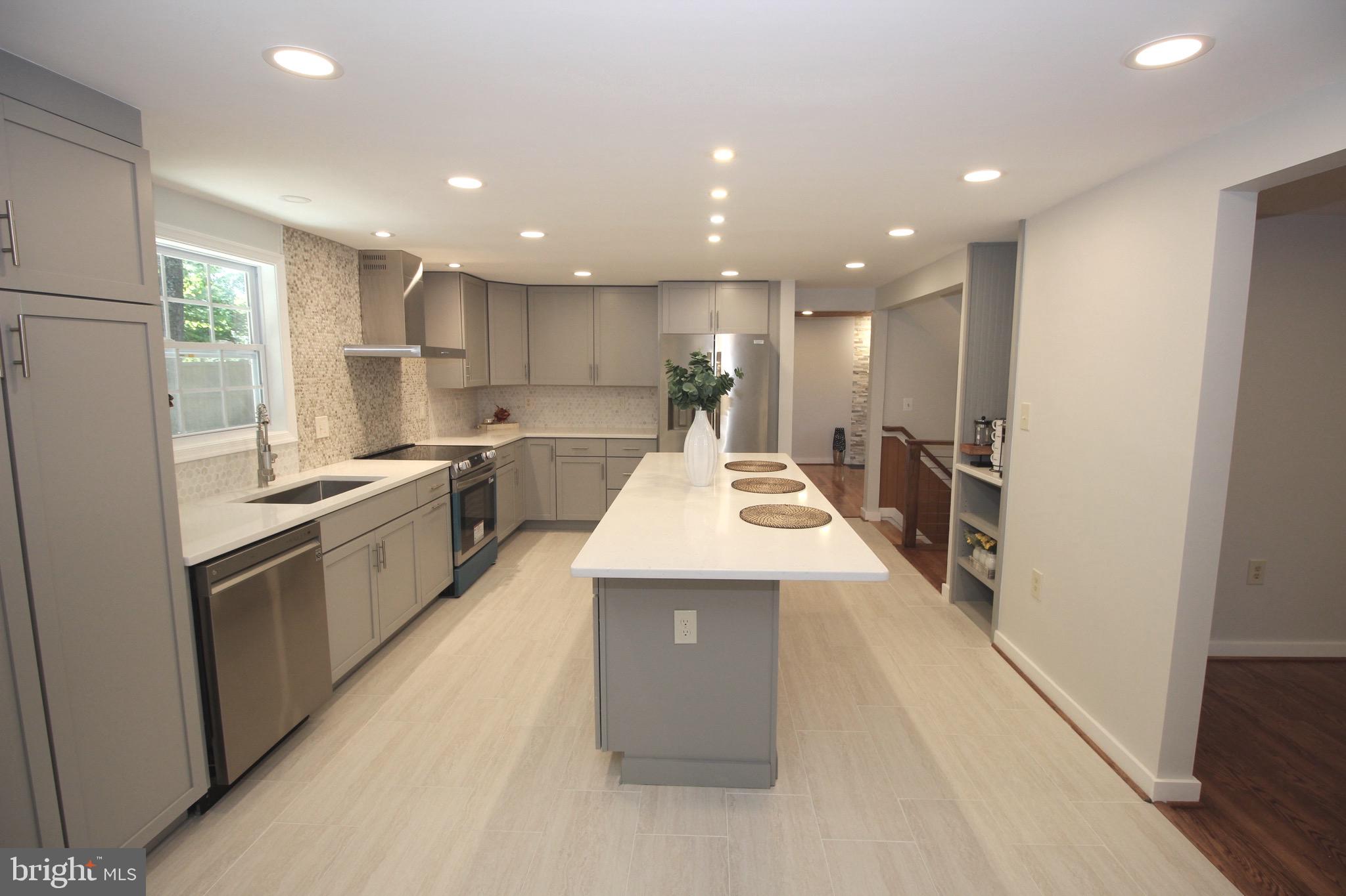2283 Dosinia Court Reston, VA 20191 - Photo 2 of 28 a large kitchen with stainless steel appliances lots of counter top space and cabinets