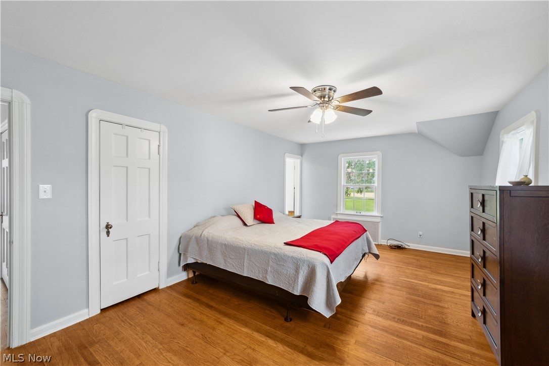 3045 Keswick Road Cleveland, OH 44120 - Photo 28 of 48 Bedroom with ceiling fan, light hardwood / wood-style floors, and lofted ceiling