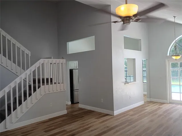 a view of an entryway and wooden floor