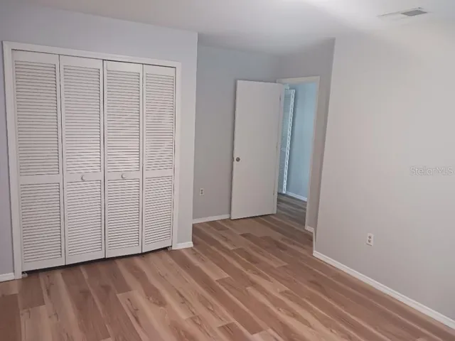 a view of a livingroom with wooden floor