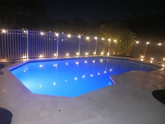 a view of a house with a swimming pool