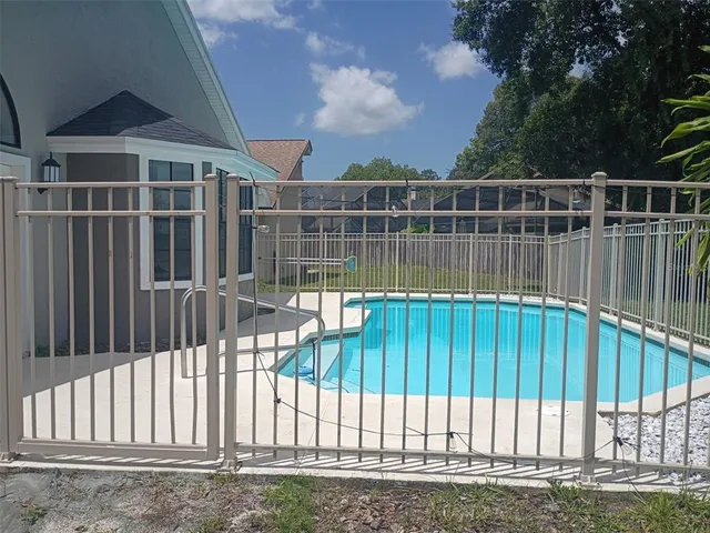 a street sign on a wall next to a building