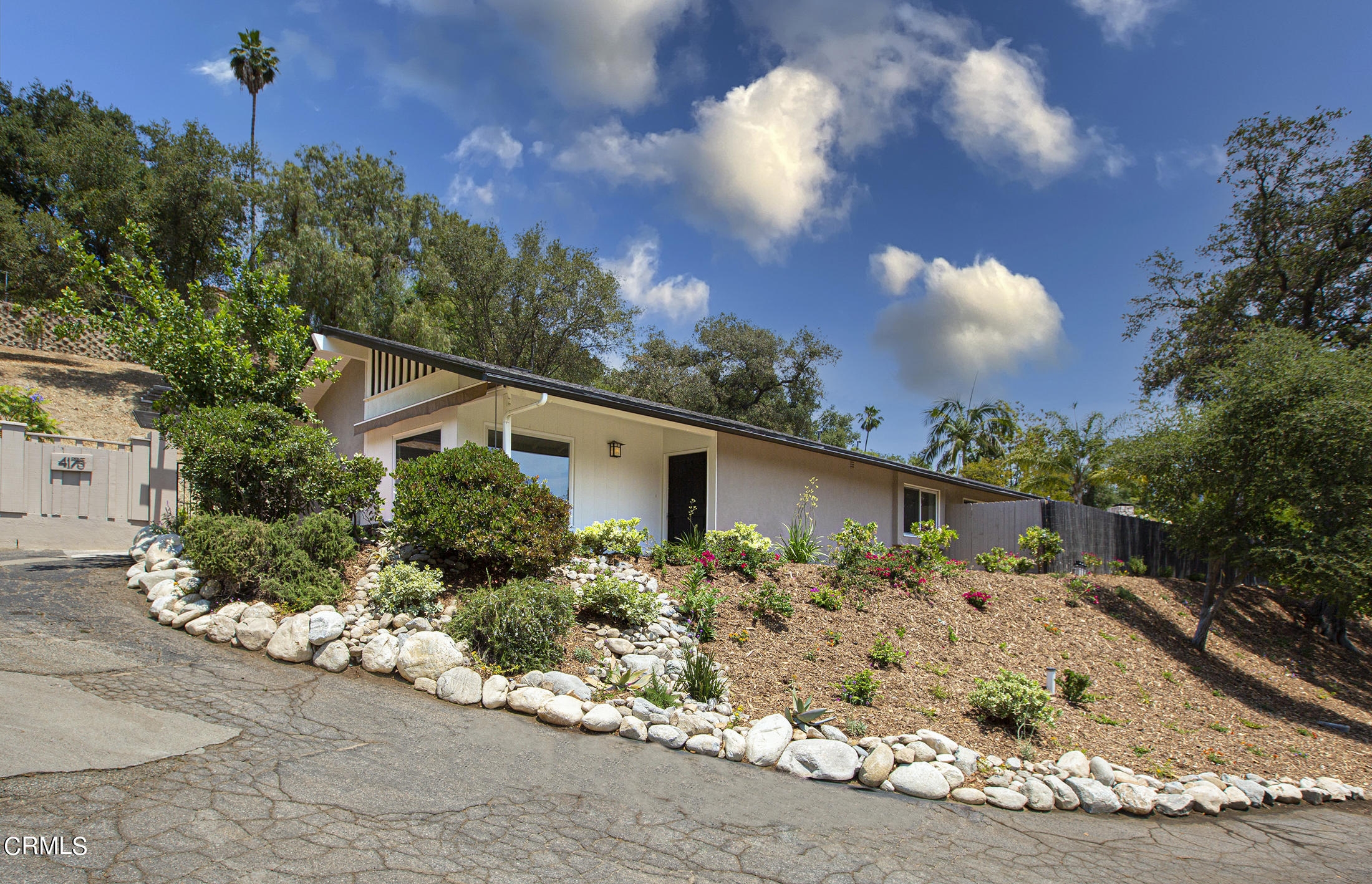 4175 Chevy Chase Drive La Canada Flintridge, CA 91011 - Photo 1 of 40 a view of a house with a yard and garden