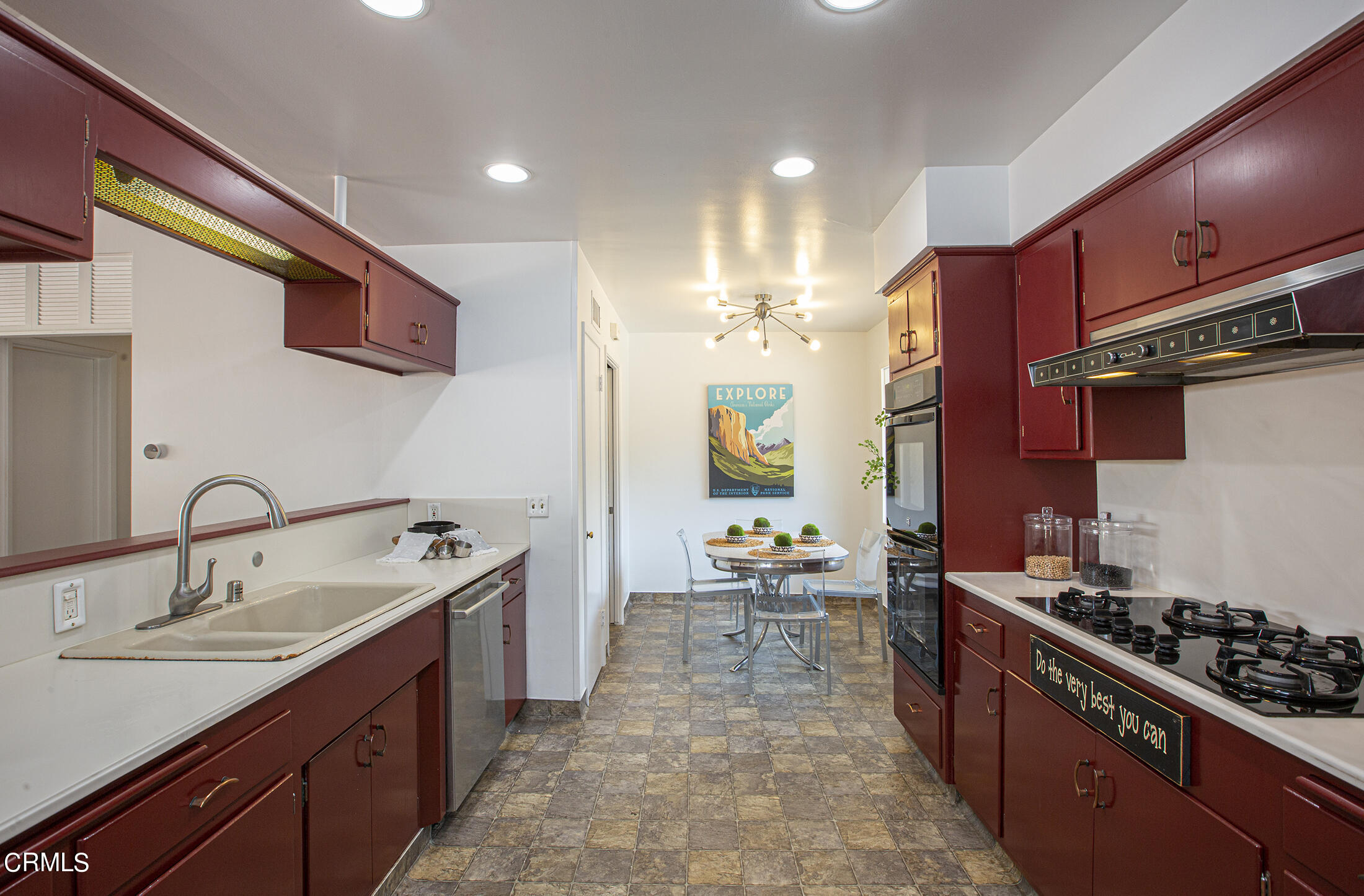 4175 Chevy Chase Drive La Canada Flintridge, CA 91011 - Photo 11 of 40 a kitchen with stainless steel appliances a sink stove and cabinets