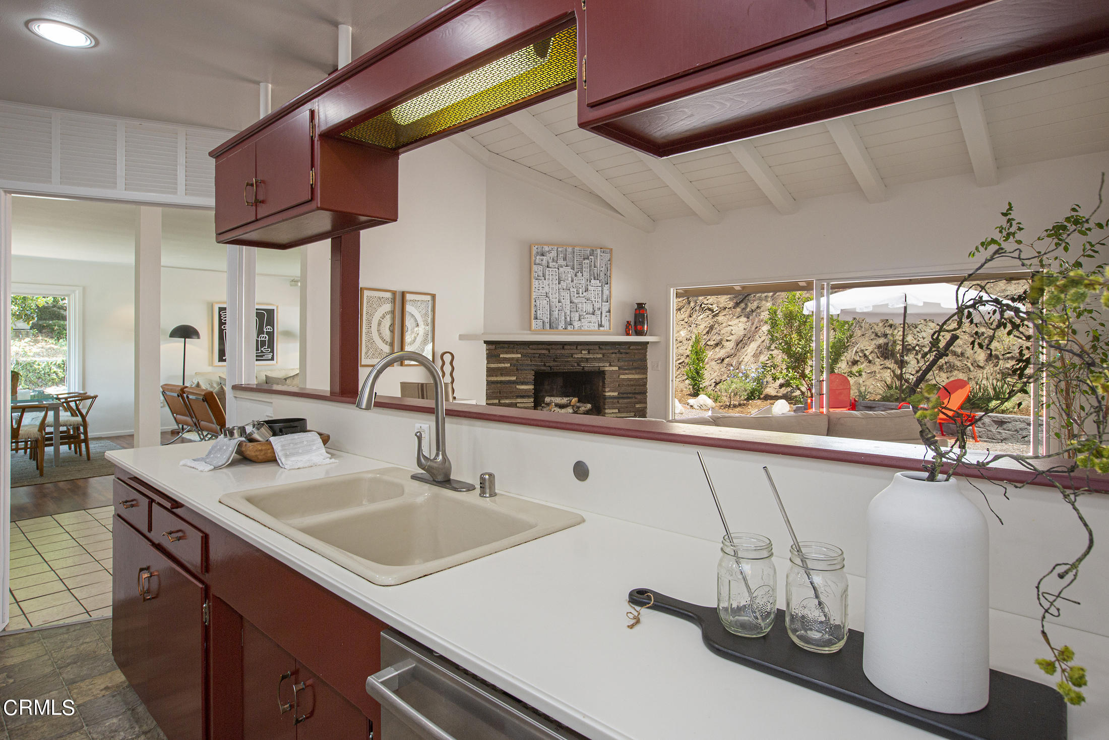 4175 Chevy Chase Drive La Canada Flintridge, CA 91011 - Photo 16 of 40 a kitchen with a sink a counter top space and a fireplace