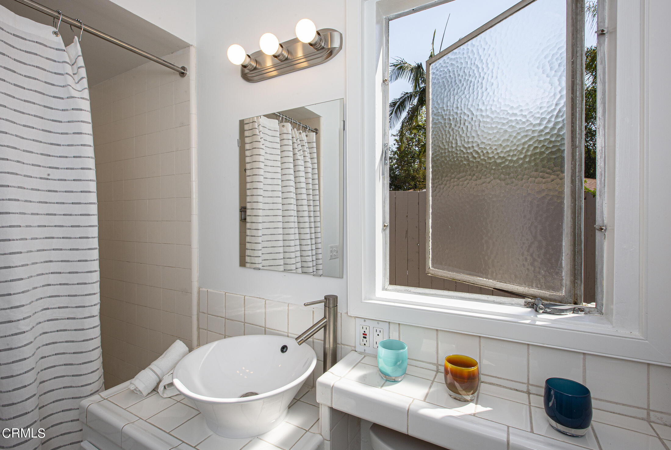 4175 Chevy Chase Drive La Canada Flintridge, CA 91011 - Photo 23 of 40 a bathroom with a sink and a mirror