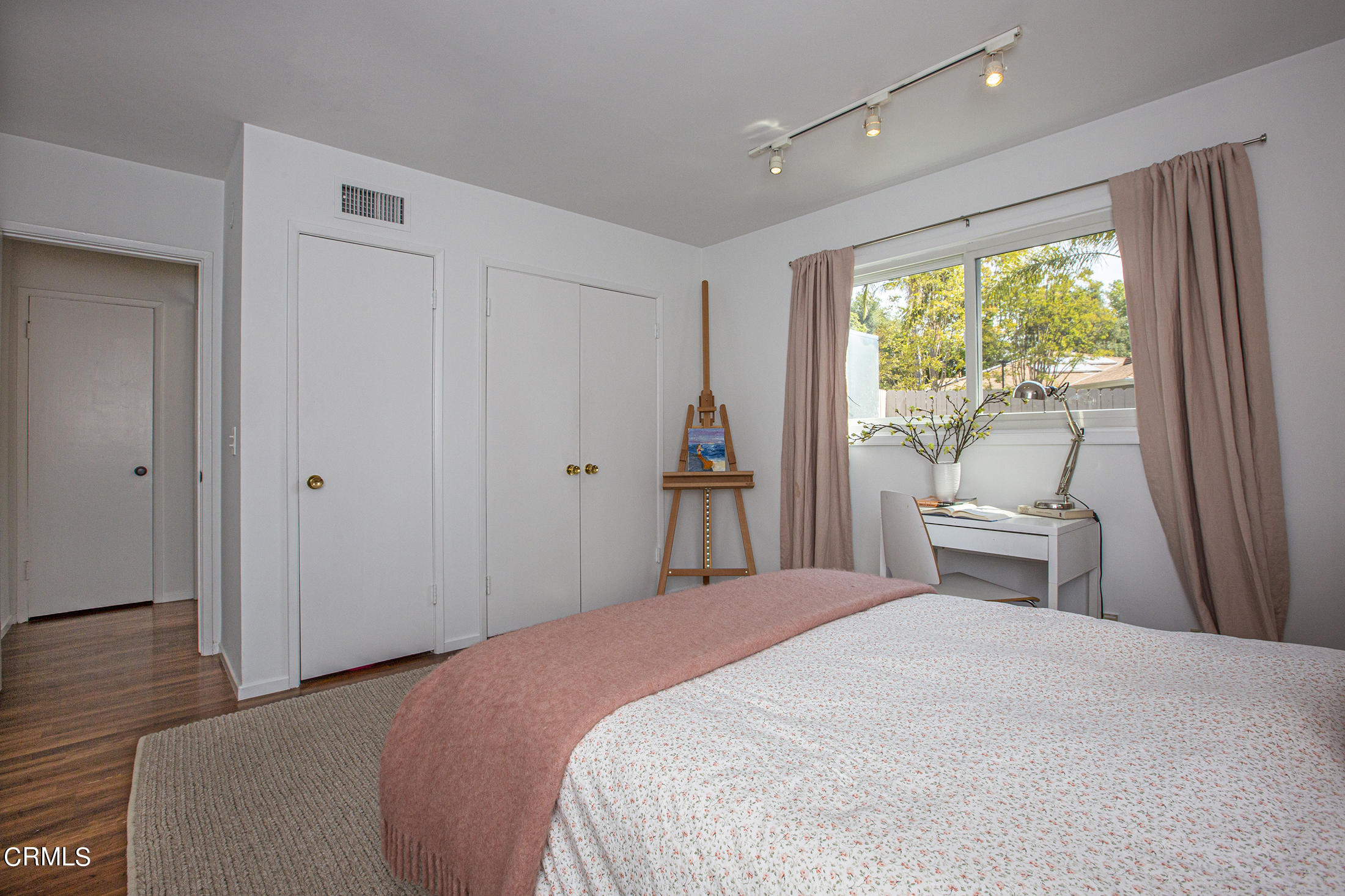 4175 Chevy Chase Drive La Canada Flintridge, CA 91011 - Photo 28 of 40 a bedroom with a large bed and wooden floor