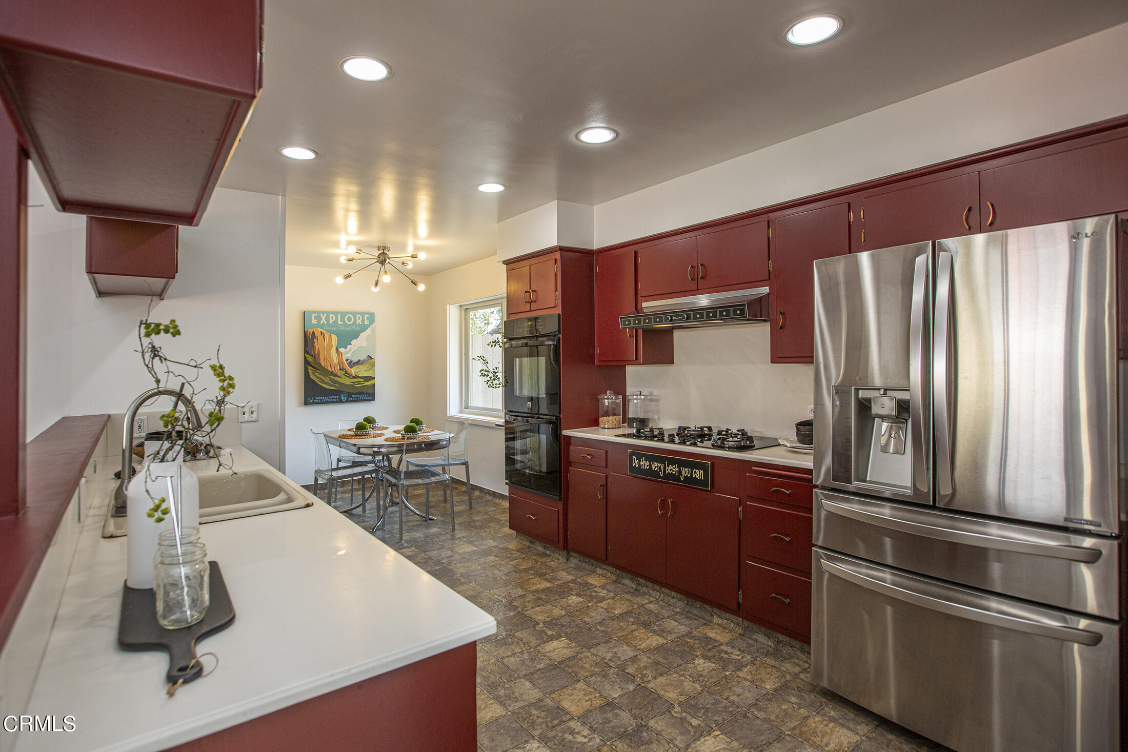 4175 Chevy Chase Drive La Canada Flintridge, CA 91011 - Photo 10 of 40 a kitchen with stainless steel appliances granite countertop a sink stove and refrigerator