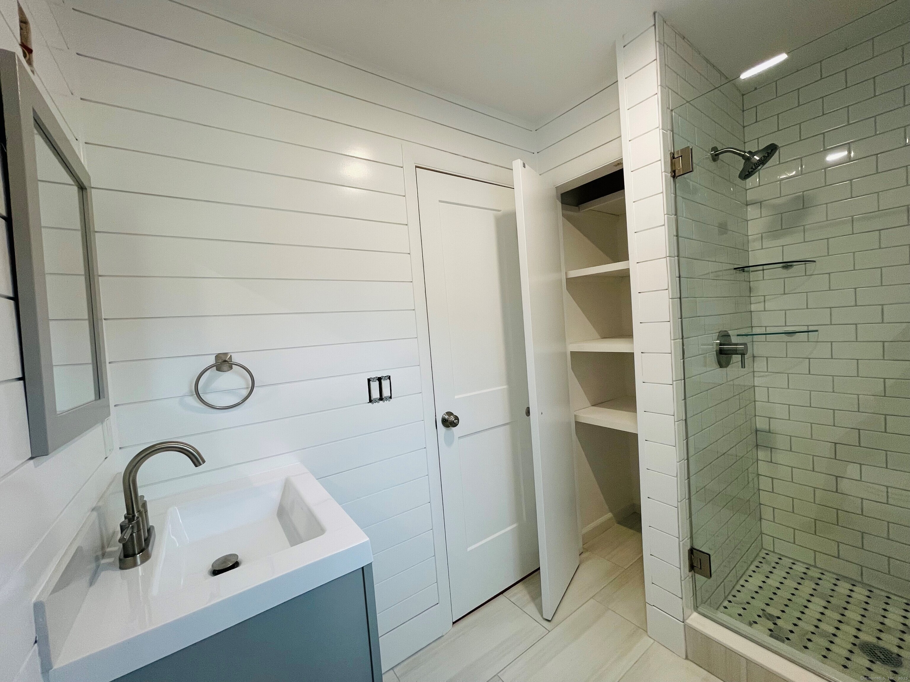 317 Strawberry Hill Avenue Norwalk, CT 06851 - Photo 11 of 30 a bathroom with a shower and a sink