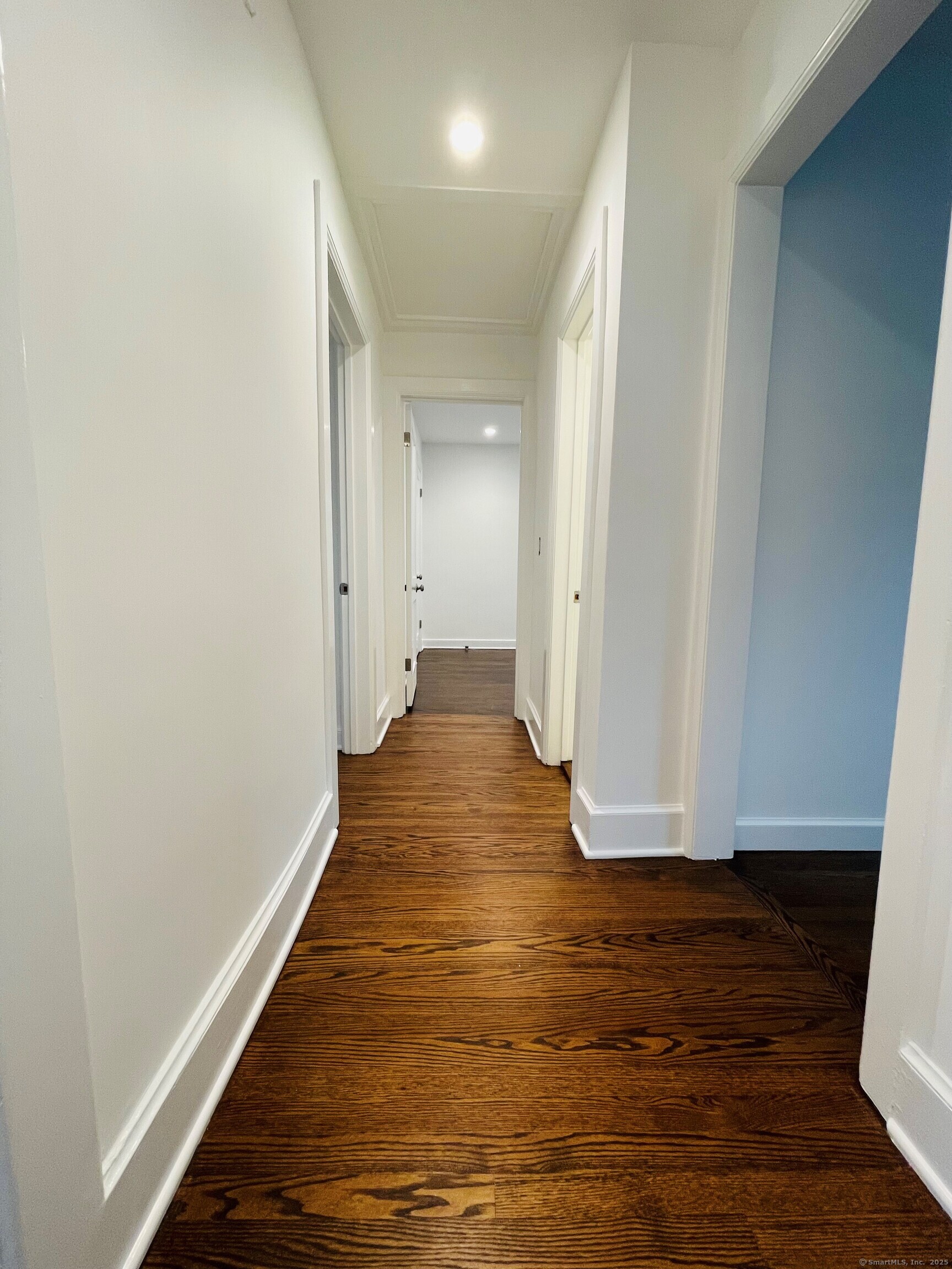 317 Strawberry Hill Avenue Norwalk, CT 06851 - Photo 13 of 30 a view of a hallway with wooden floor