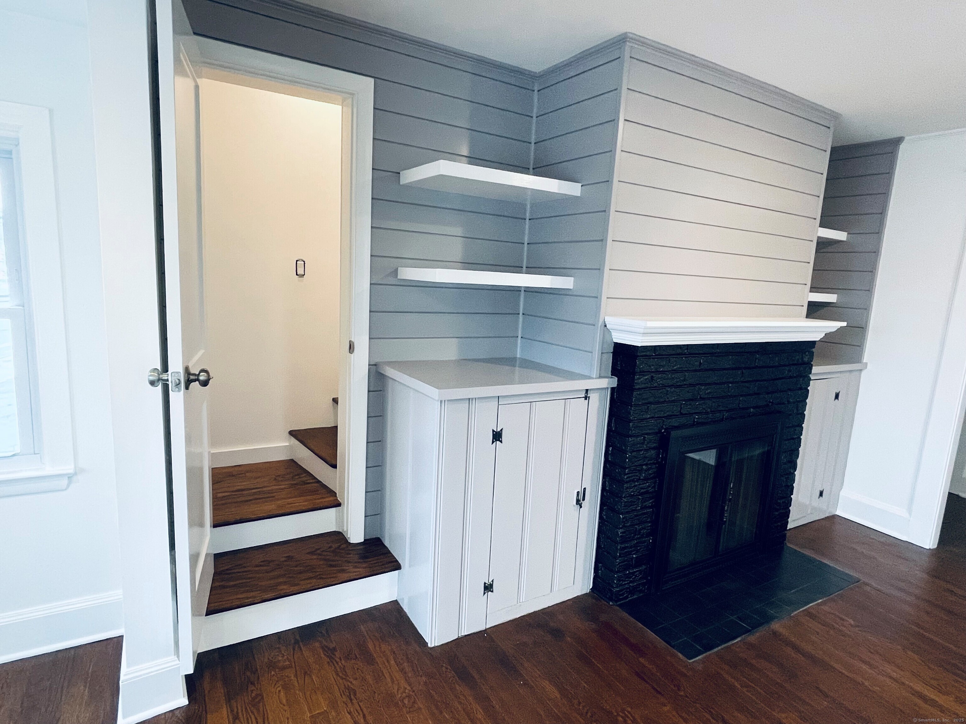 317 Strawberry Hill Avenue Norwalk, CT 06851 - Photo 24 of 30 a view of a hallway with wooden floor and staircase