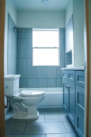 a bathroom with a toilet a sink and a bathtub