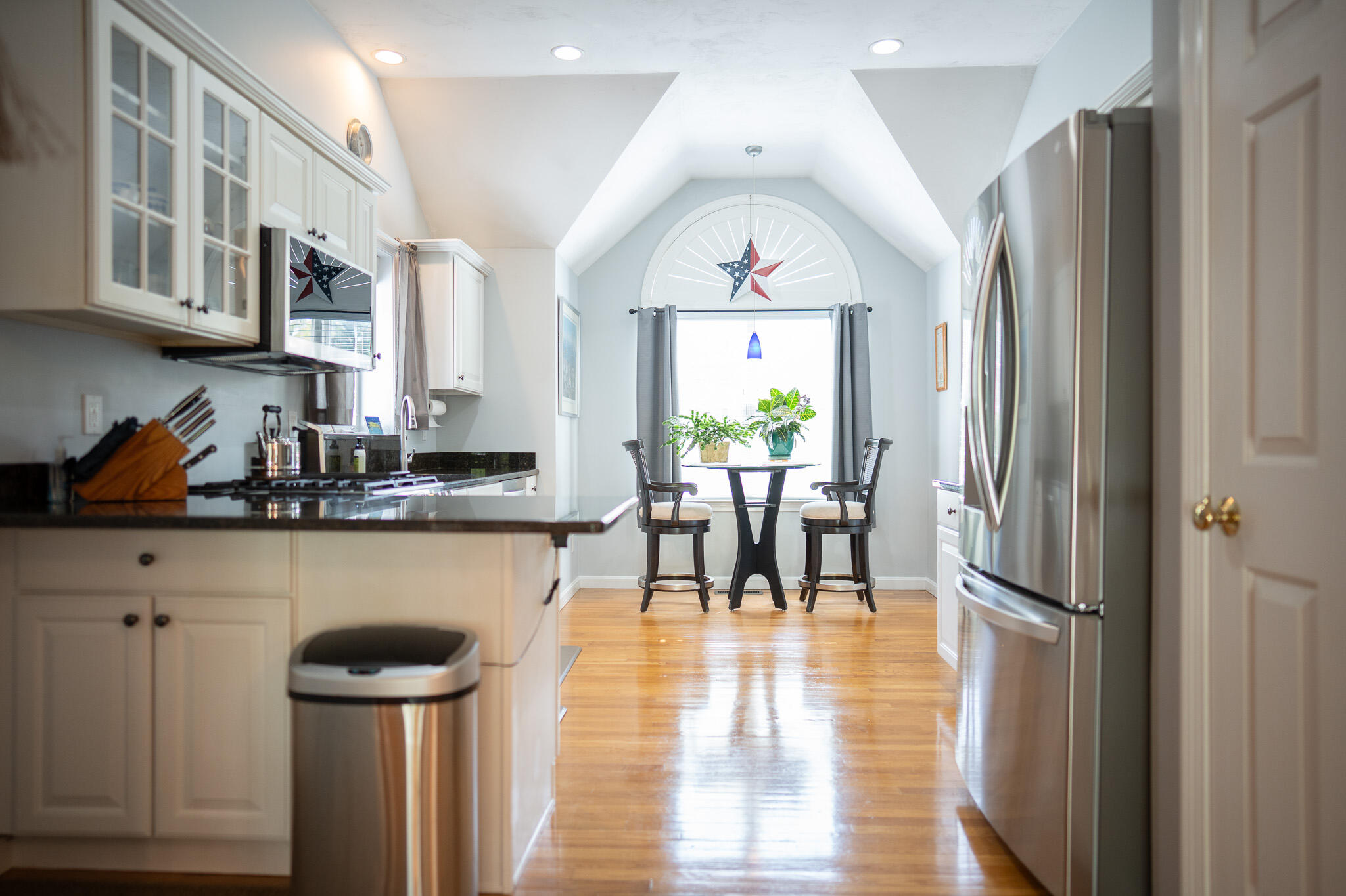 12 Sheffield Place Mashpee, MA 02649 - Photo 12 of 61 a kitchen with stainless steel appliances granite countertop a refrigerator a stove and a wooden floors