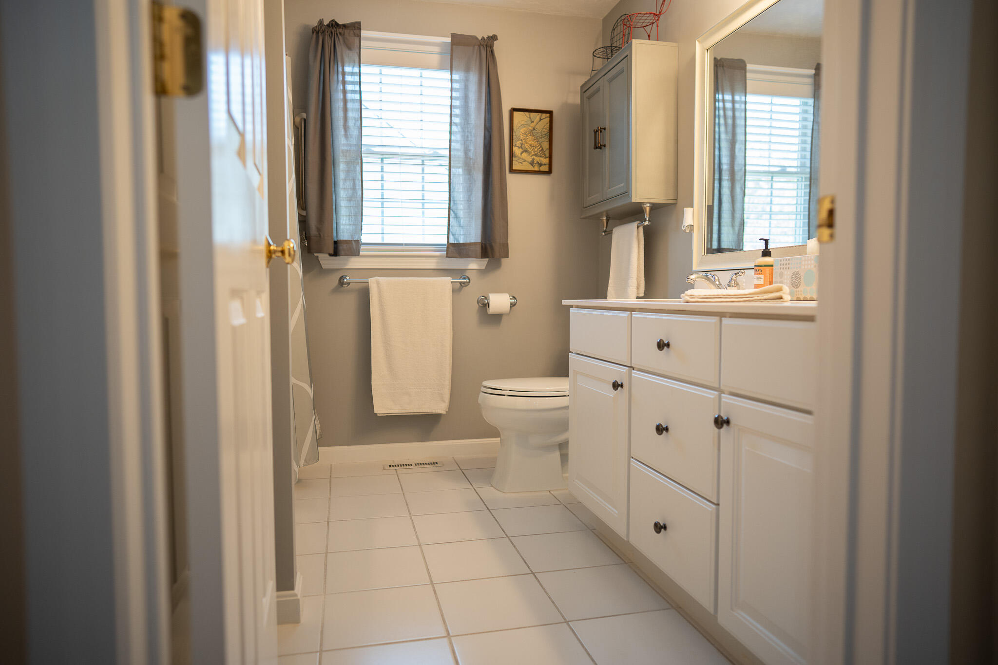 12 Sheffield Place Mashpee, MA 02649 - Photo 27 of 61 a bathroom with a sink a toilet and a window