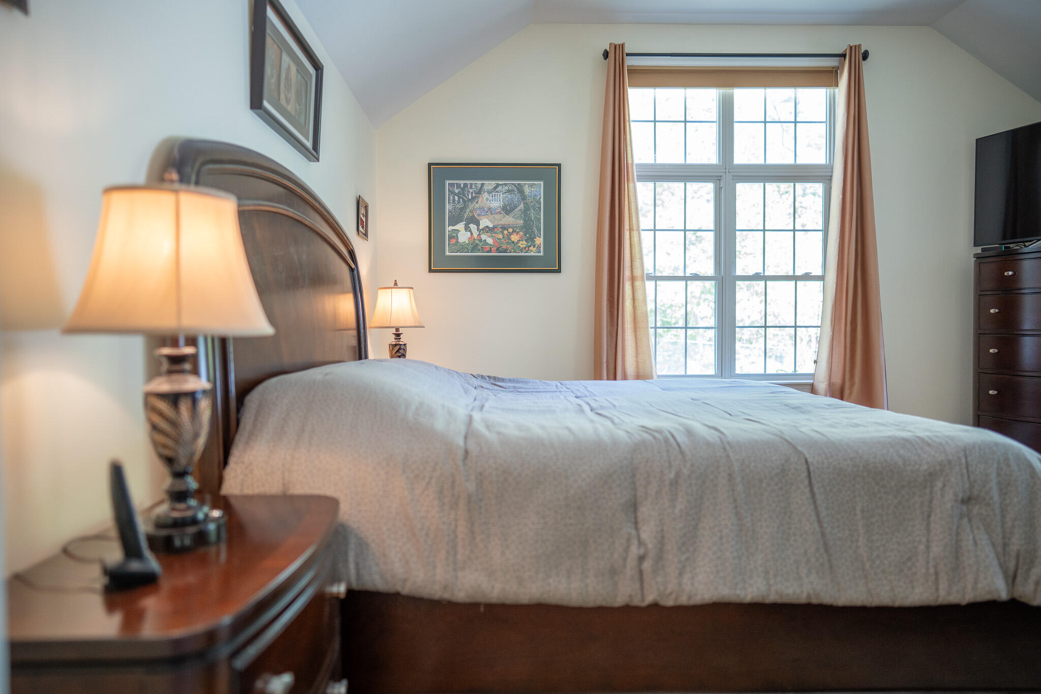 12 Sheffield Place Mashpee, MA 02649 - Photo 32 of 61 a bedroom with a bed and a mirror on dresser