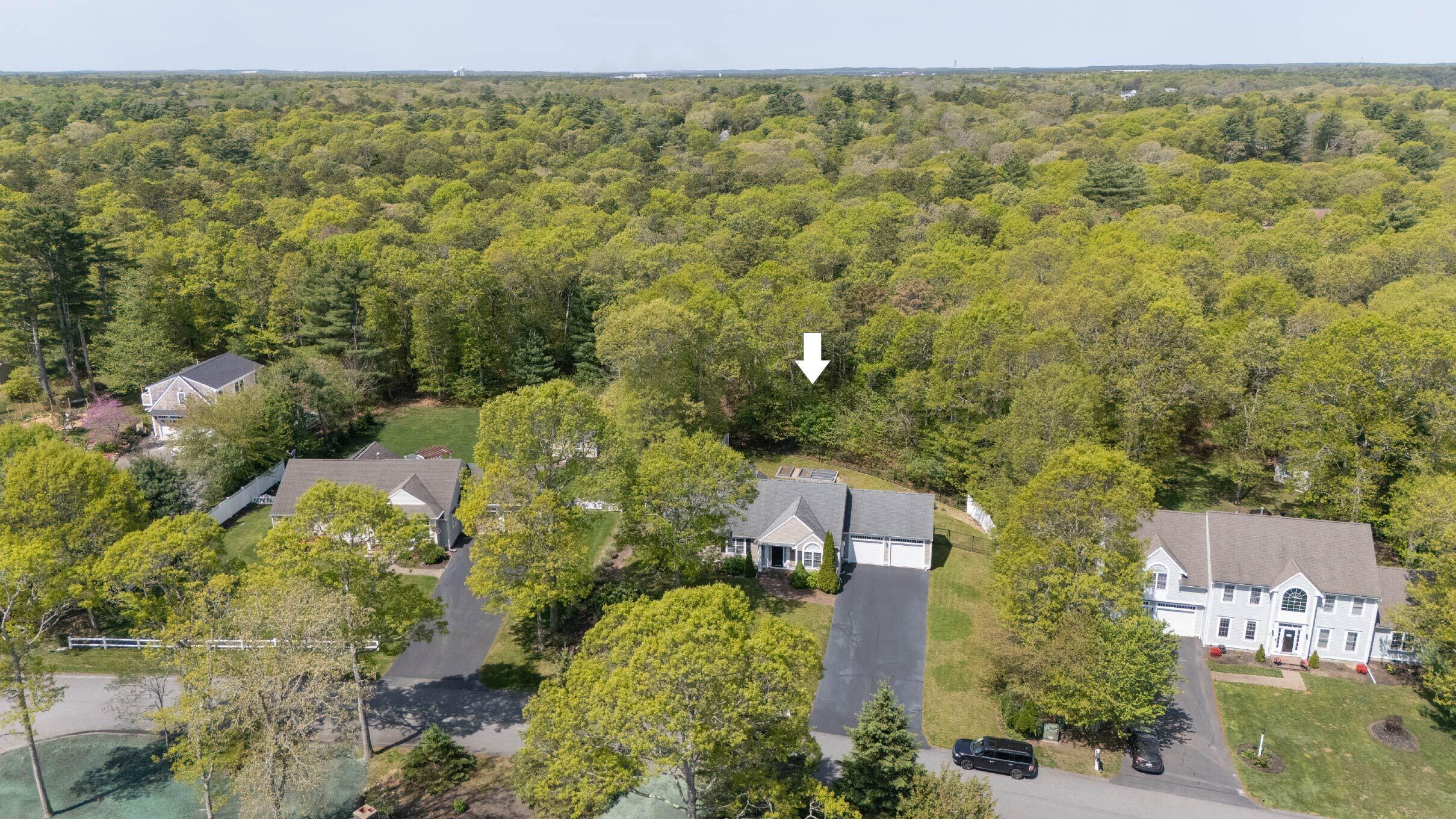 12 Sheffield Place Mashpee, MA 02649 - Photo 5 of 61 an aerial view of a house with a yard