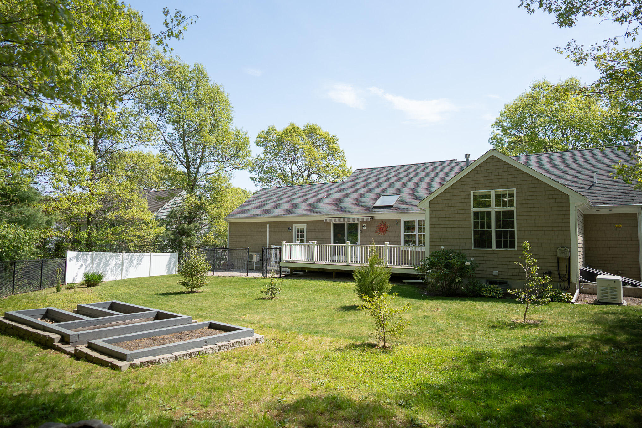 12 Sheffield Place Mashpee, MA 02649 - Photo 55 of 61 a front view of house with yard and outdoor seating