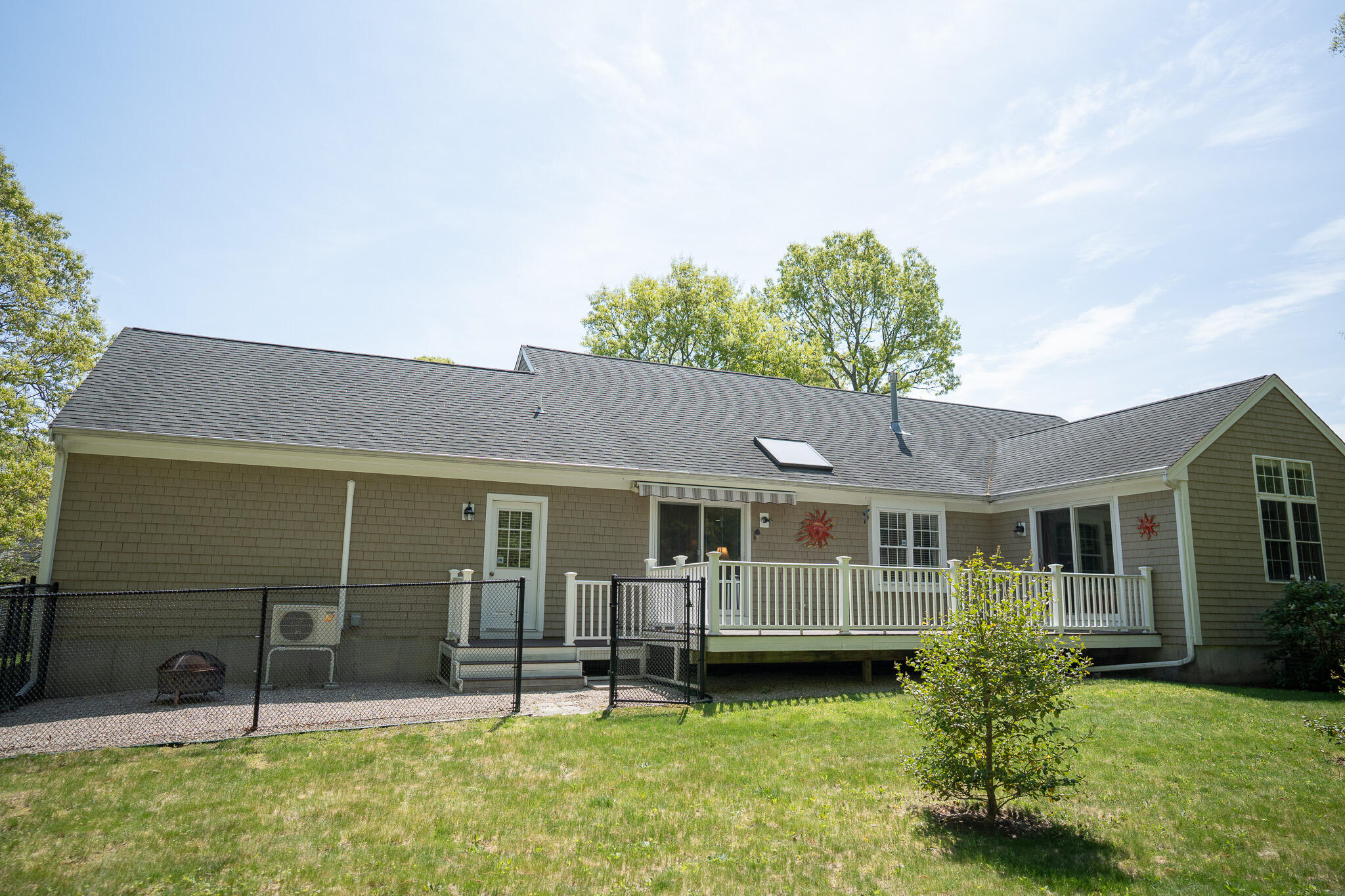 12 Sheffield Place Mashpee, MA 02649 - Photo 56 of 61 a backyard of a house with yard table and chairs