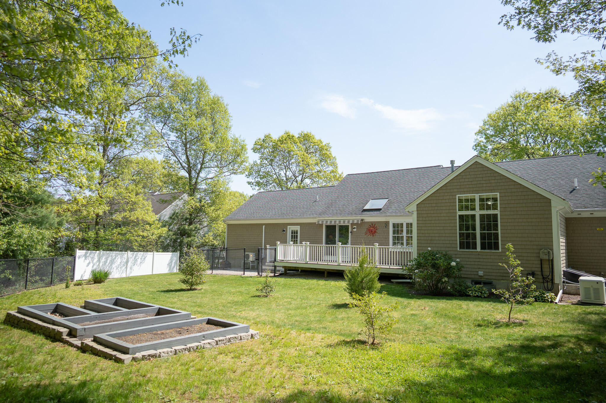 12 Sheffield Place Mashpee, MA 02649 - Photo 57 of 61 a view of a house with a yard patio and fire pit