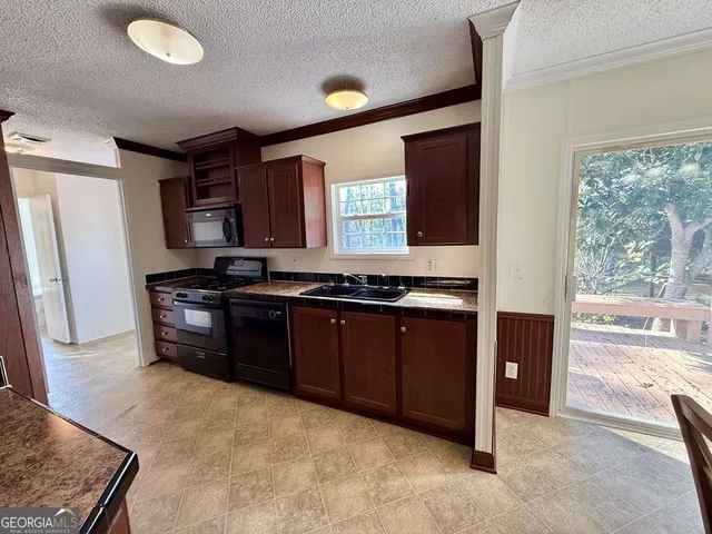 a bed room with a bed and a chandelier