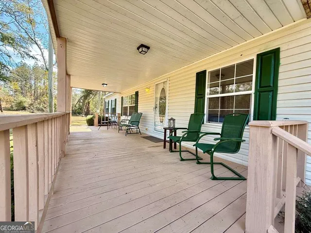 a kitchen with stainless steel appliances granite countertop a stove a refrigerator and a cabinets
