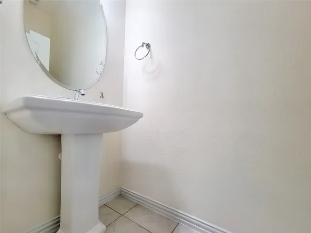 a bathroom with a sink and mirror