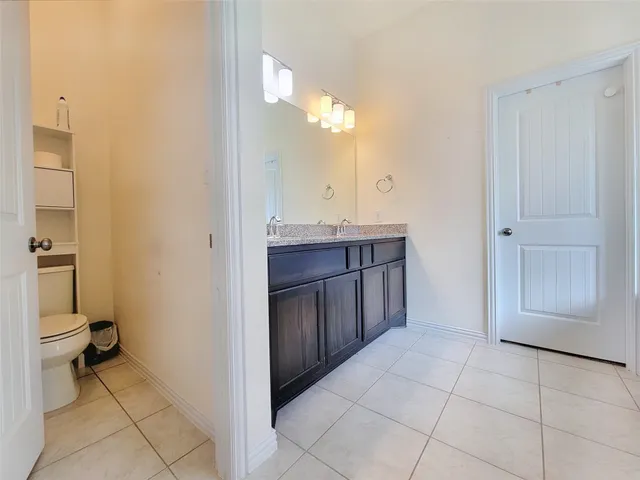 a view of a bathroom with a sink and a mirror