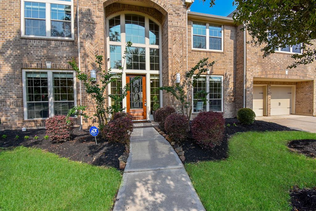 Soaring blue skies above; sunlight warming the main entrance and attentive landscaping below present this palatial single family, 2-story brick treasure, located at 9903 Touhy Lane, Katy, TX, in the master planned Cinco Ranch Southwest community.