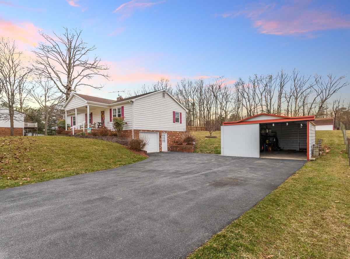 4233 Cold Springs Road Raphine, VA 24472 - Photo 5 of 50 a view of a house with a yard and garage