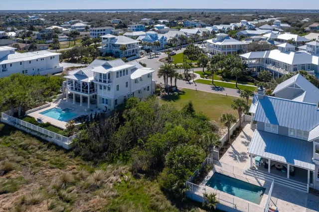 an aerial view of a house with a garden