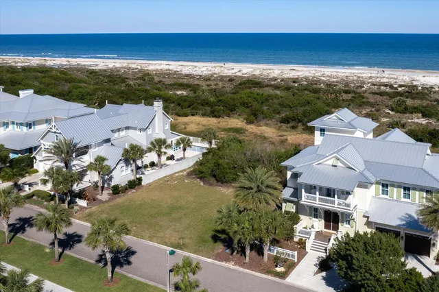 an aerial view of a house with a lake view