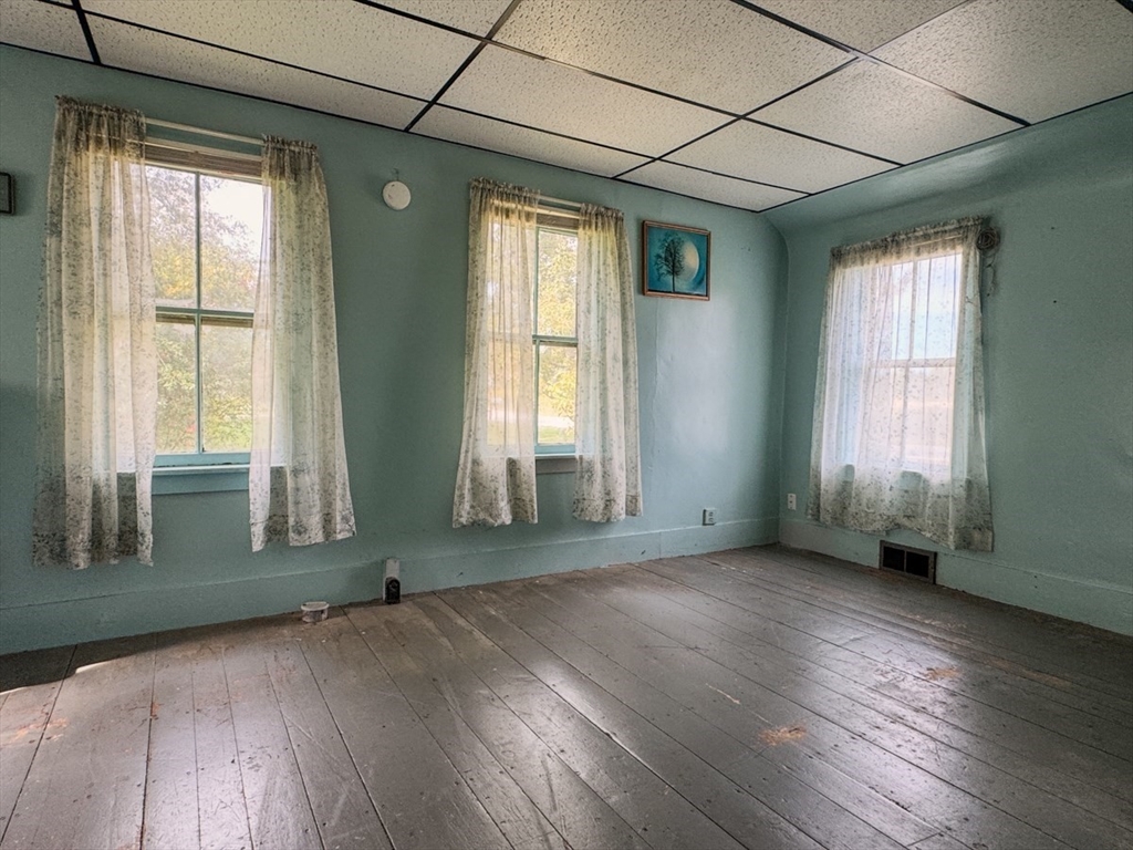 294 Capt Beers Plain Road Northfield, MA 01360 - Photo 13 of 41 an empty room with wooden floor and windows