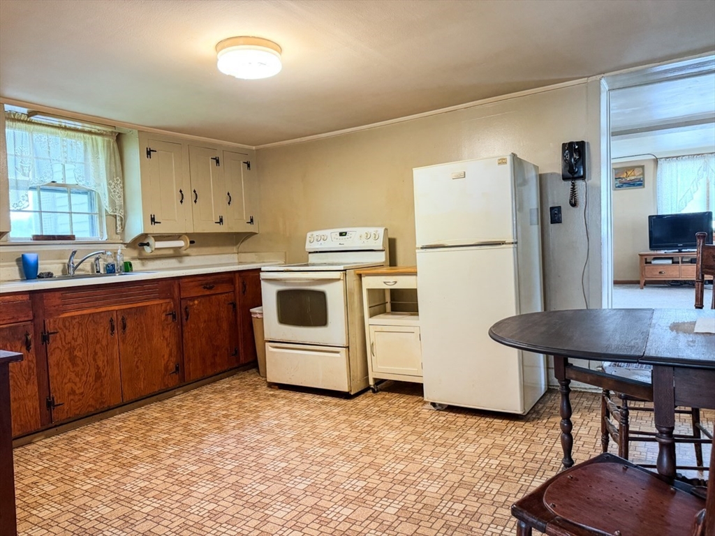 294 Capt Beers Plain Road Northfield, MA 01360 - Photo 9 of 41 a kitchen with a stove a refrigerator and a sink