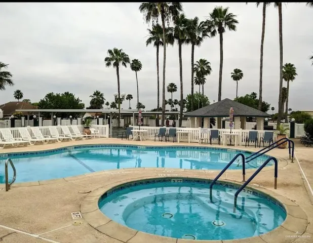 a view of a swimming pool with a lounge chair