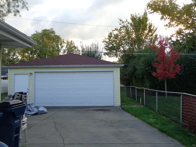 a front view of a house with garage
