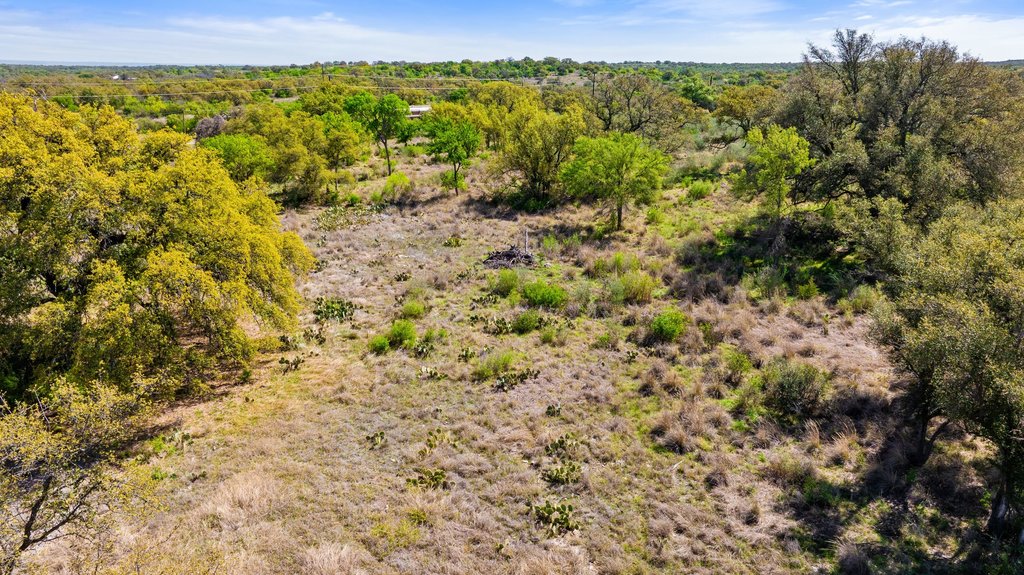 9580 Smith West Ranch Road Round Mountain, TX 78663 - Photo 20 of 26 a view of a field with an outdoor space