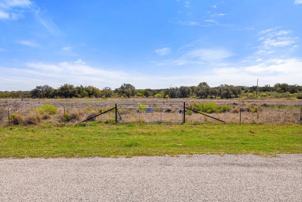 9580 Smith West Ranch Road Round Mountain, TX 78663 - Photo 7 of 26 a view of a lake with houses in the back