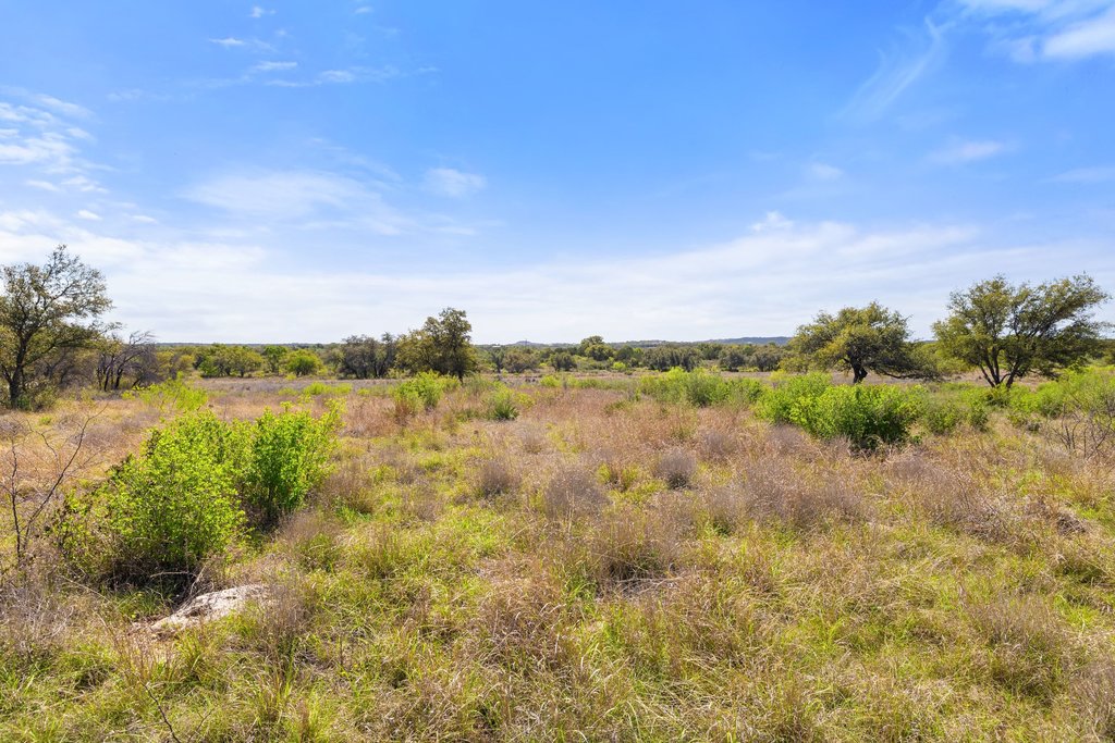 9580 Smith West Ranch Road Round Mountain, TX 78663 - Photo 8 of 26 a view of a lake with houses in the back