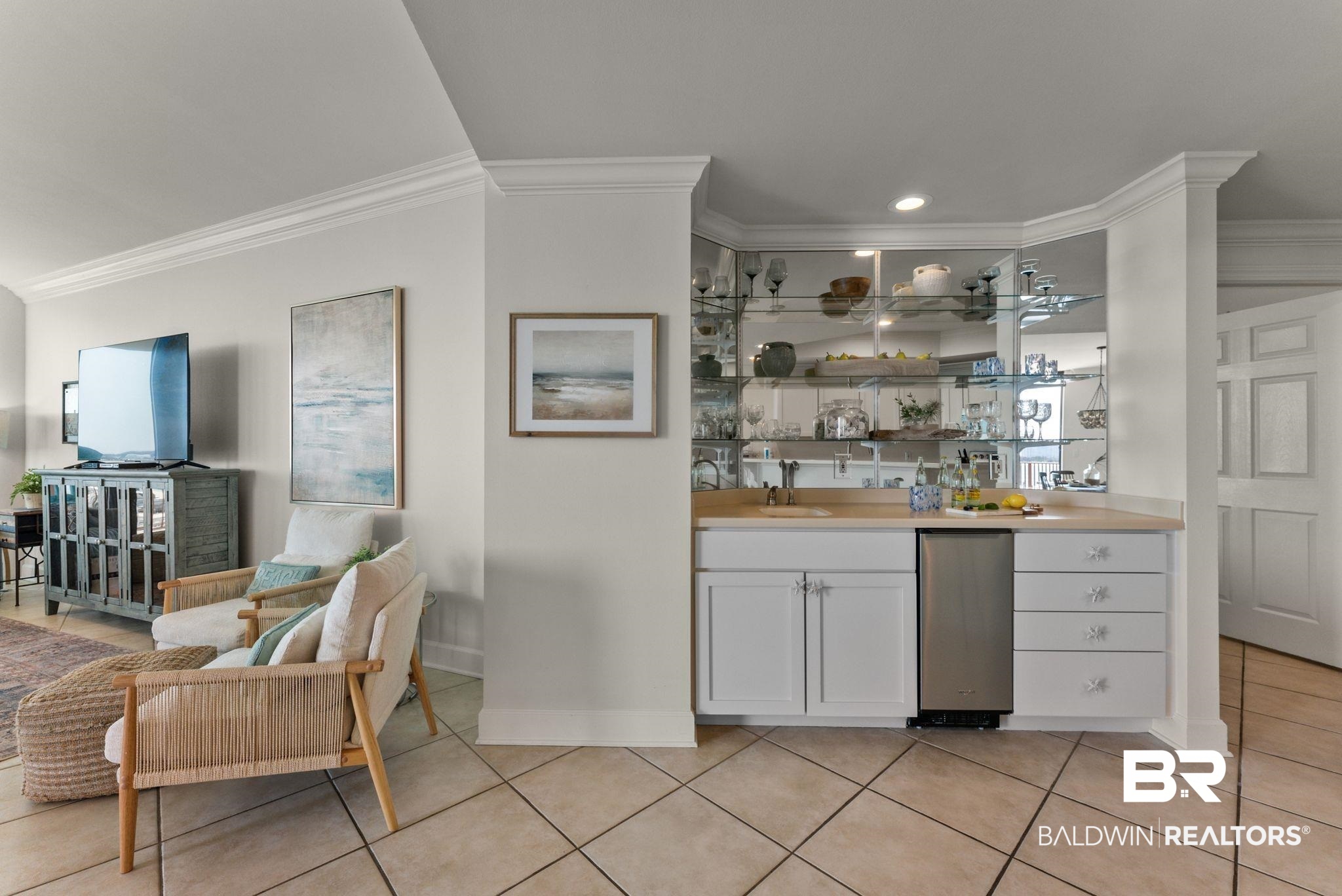 27580 Canal Road, Unit 1233 Orange Beach, AL 36561 - Photo 42 of 79 Indoor wet bar featuring white cabinets, crown molding, light countertops, open shelves, and light tile patterned flooring