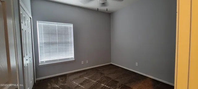 a view of a room that has a window in it