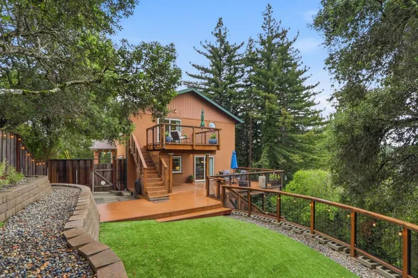 a backyard of a house with a yard and fountain