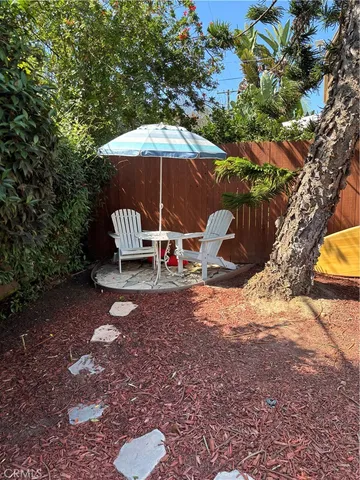 a view of a outdoor space with backyard and trees