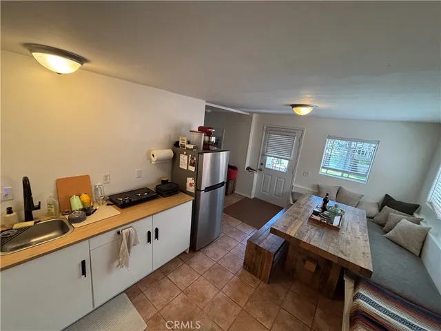 a hallway with a view of living room