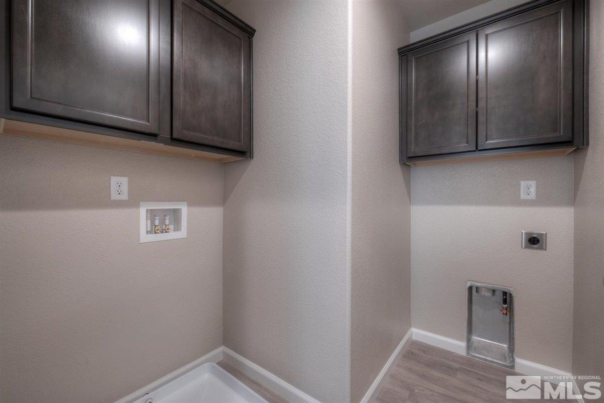 3408 Colonial Downs, Unit LOT 54 Reno, NV 89512 - Photo 22 of 26 a view of a hallway with wooden floor