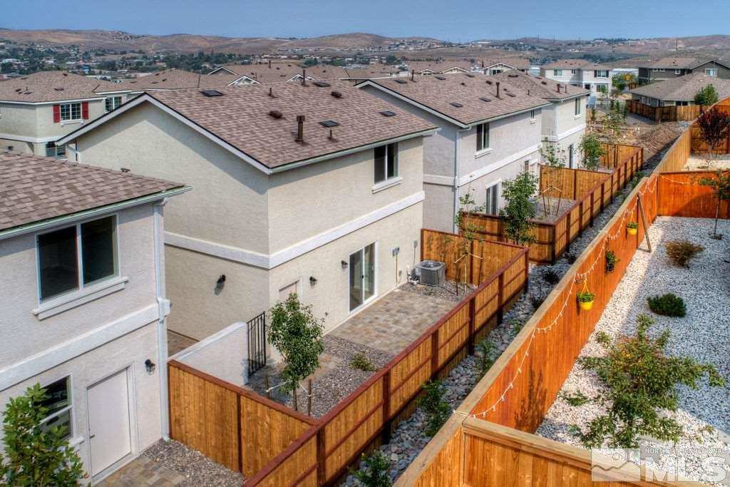 3408 Colonial Downs, Unit LOT 54 Reno, NV 89512 - Photo 26 of 26 an aerial view of multiple houses with a yard