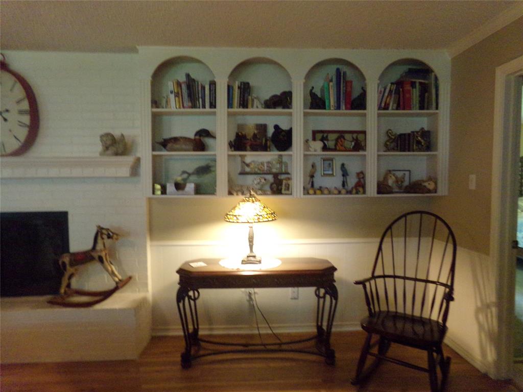 5110 Wedgefield Road Granbury, TX 76049 - Photo 7 of 23 Built-in arched shelving above wainscoting and hardwood-finish flooring