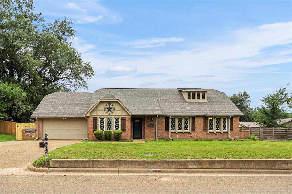 1102 Mill Run Road Athens, TX 75751 - Photo 35 of 35 a front view of a house with a garden and parking