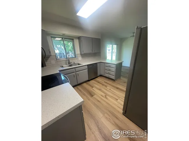 a view of a livingroom with wooden floor